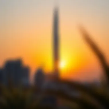 The unique silhouette of the twisting Cactus Tower against a sunset backdrop